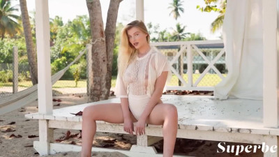 Cute blondie shows off her perfect body in tropics solo