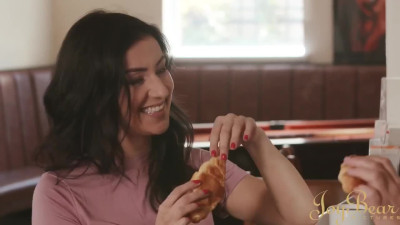 Playful brunettes enjoy passionate lesbian moments in a public bar.
