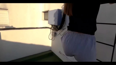Skinny brunette is having a hot public sex with her bf on the roof