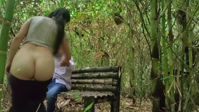 Adventurous couple enjoy each other having oral sex on the bench at the park
