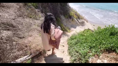 On the beach, Cami Strella wants to get her hands on the man's cock on the beach