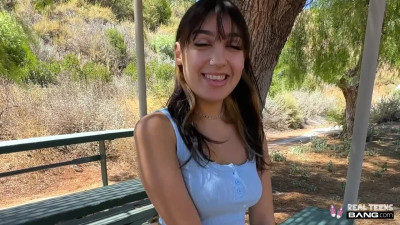 Pretty brunette Violet Gems is sucking and riding a guy's cock at the park