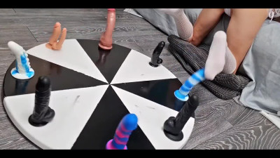 The wife puts the dildos on a wheel of fortune to have some fun with