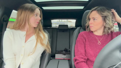 Horny babes are having fun in a car with a vibrator