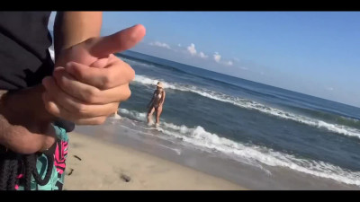 Two whores give stranger head and handjob on public beach
