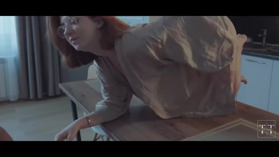 Redhead harlot gets banged on the table and swallows the cumshot