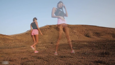 Arousing teen plays with her sweet pussy in the desert while no one's around