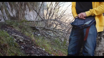 Naugty dude gets a nice handjob in the woods and cums very intensively