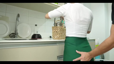 An ordinary Asian housewife is having a quickie in the kitchen