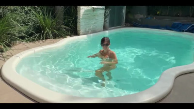 Well-shaped Milf shakes naturals by the pool - POV